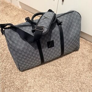 Jordan Gray and Black Duffel Bag